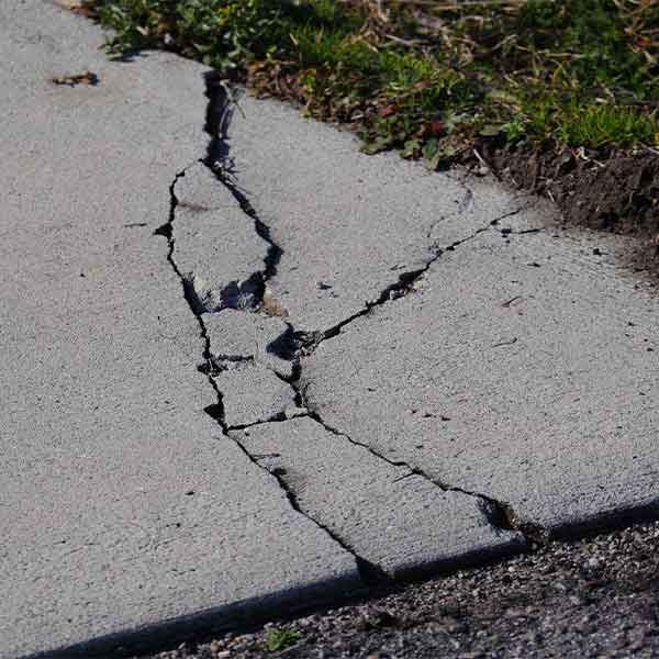 cracked pavement needs repairing