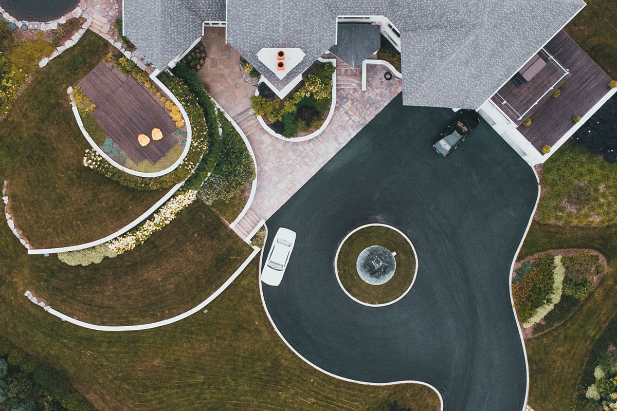 can asphalt be laid over concrete driveway